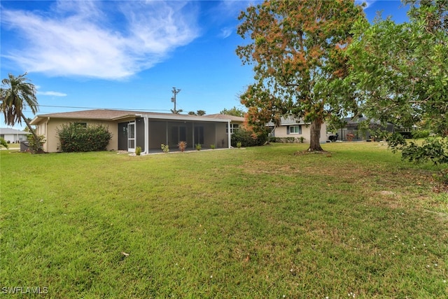 view of yard with a sunroom