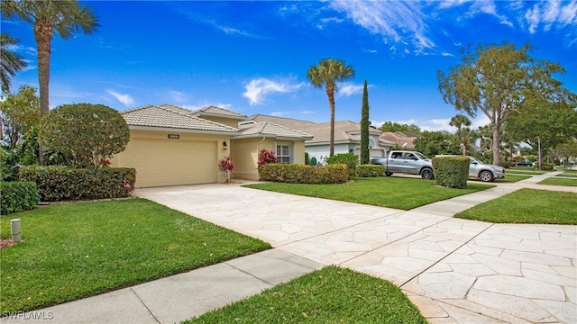 view of front of property featuring a garage, a tiled roof, concrete driveway, stucco siding, and a front yard