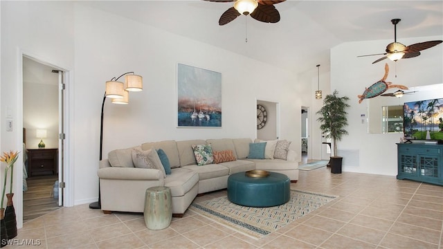 living room featuring a ceiling fan, high vaulted ceiling, and light tile patterned floors