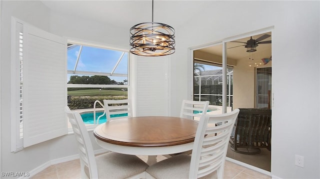 dining area featuring light tile patterned floors and a chandelier