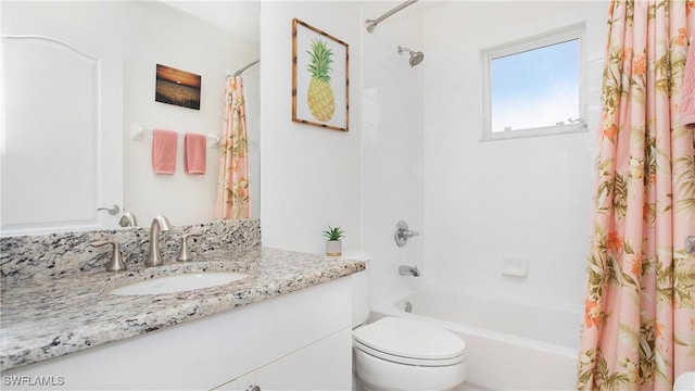 full bath with toilet, shower / tub combo, and vanity