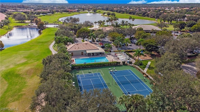 birds eye view of property featuring a water view and view of golf course