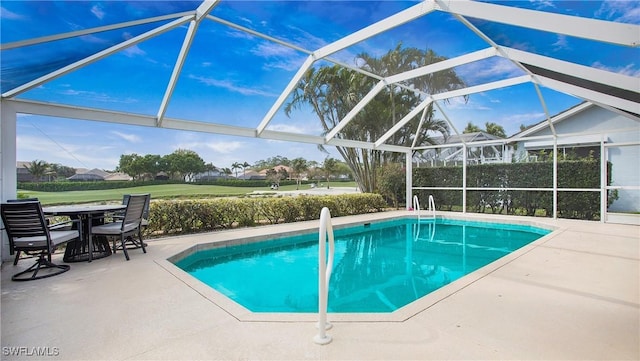 pool with a lanai and a patio area