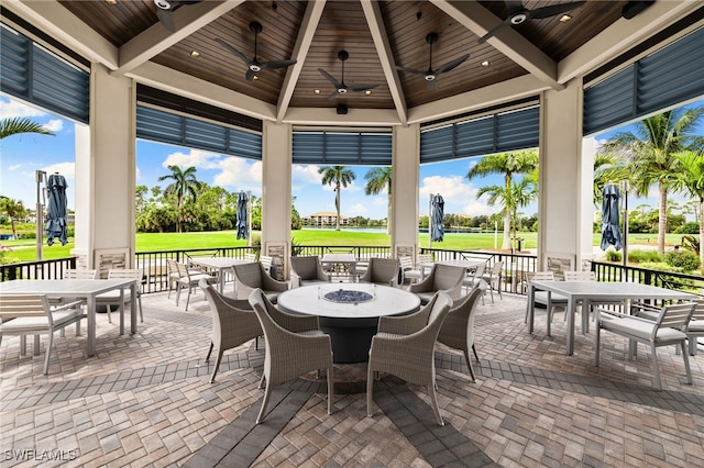 view of patio / terrace featuring a gazebo, outdoor dining area, and ceiling fan