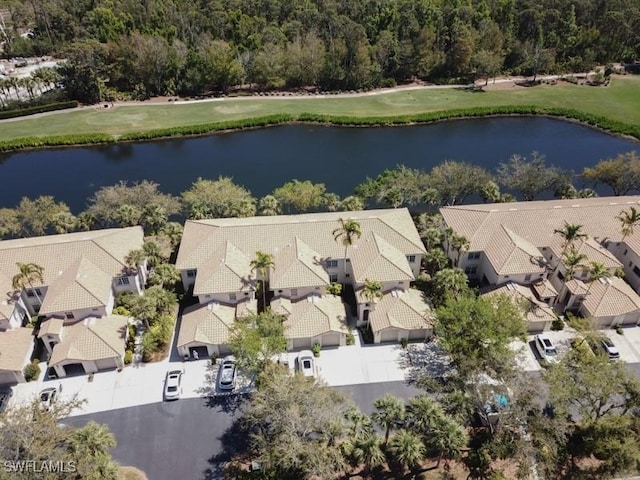 aerial view with a residential view and a water view