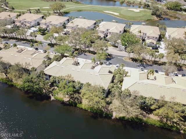 aerial view featuring golf course view, a residential view, and a water view