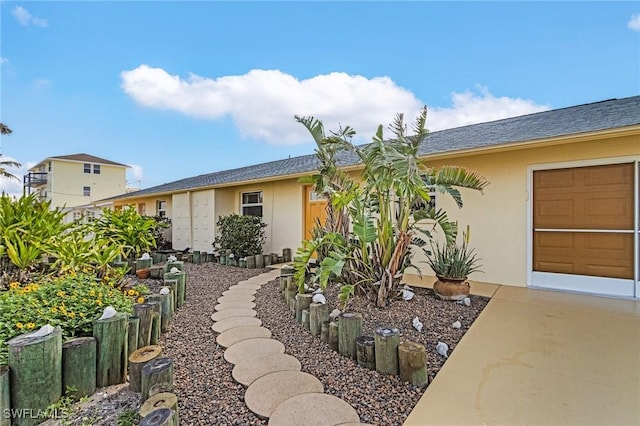 exterior space with stucco siding