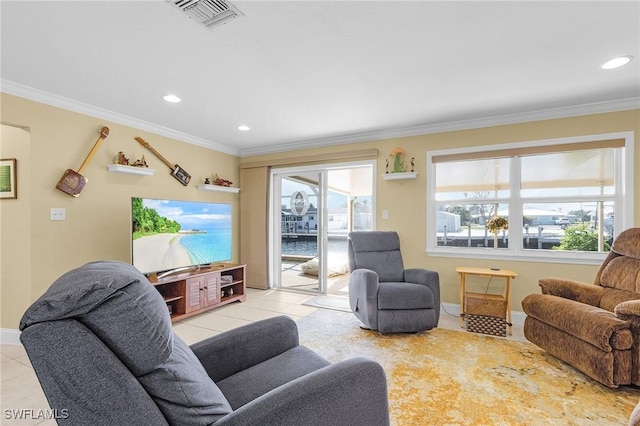 living area featuring ornamental molding, baseboards, light tile patterned floors, and visible vents