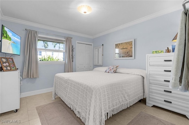 tiled bedroom featuring baseboards, a closet, and crown molding