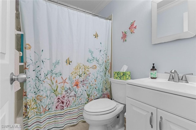 bathroom with toilet, vanity, and a shower with curtain