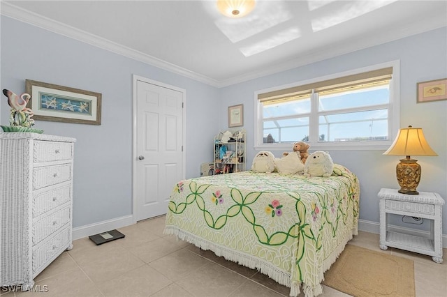 bedroom featuring tile patterned flooring, ornamental molding, and baseboards
