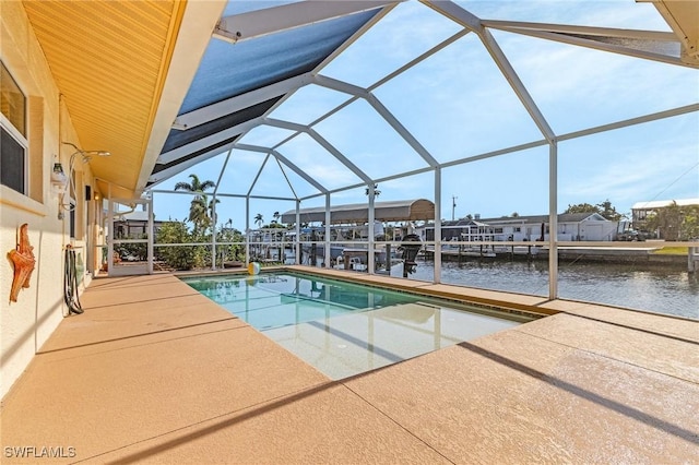 outdoor pool with a lanai, a patio area, a dock, and a water view