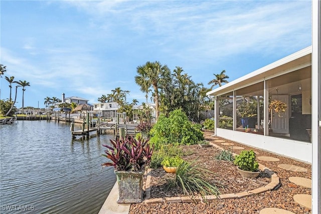 dock area featuring a water view and boat lift