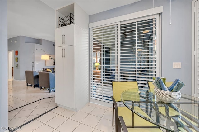 dining area with light tile patterned floors