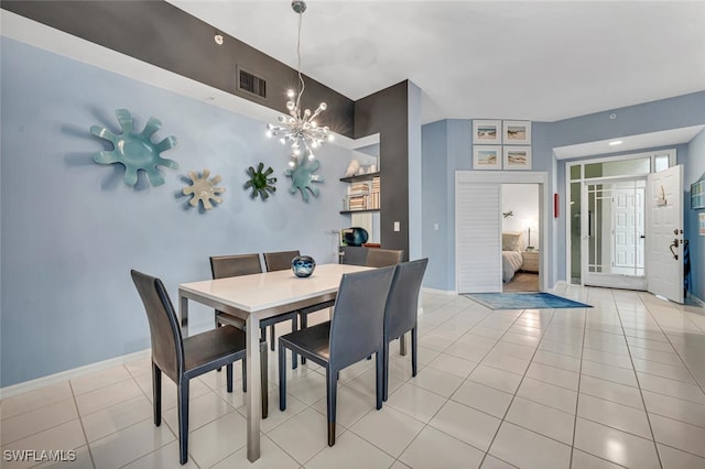 dining room featuring baseboards, visible vents, an inviting chandelier, and light tile patterned floors