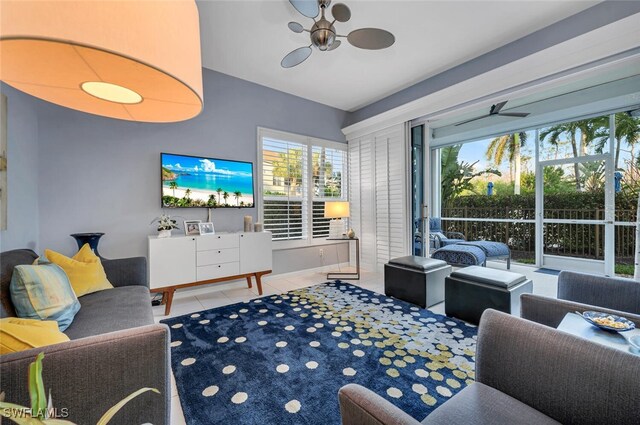 living room with tile patterned flooring and ceiling fan