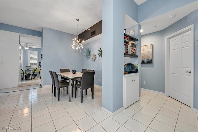 dining room featuring light tile patterned floors, ceiling fan with notable chandelier, visible vents, and baseboards