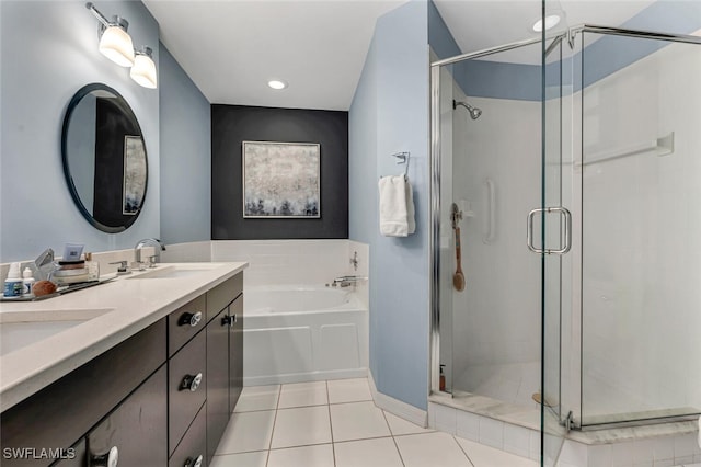 bathroom with a shower stall, a sink, a bath, and tile patterned floors