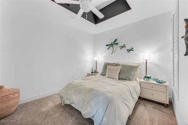 bedroom with a ceiling fan, carpet flooring, and baseboards