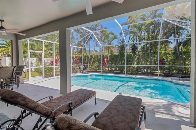 345 Sweet Bay Ln, Naples, FL 34119 - outdoor pool with ceiling fan, a patio, glass enclosure, and a fenced backyard
