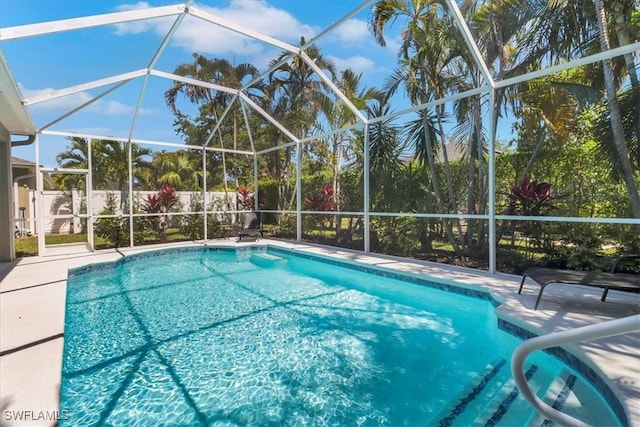 345 Sweet Bay Ln, Naples, FL 34119 - outdoor pool with a lanai and a patio