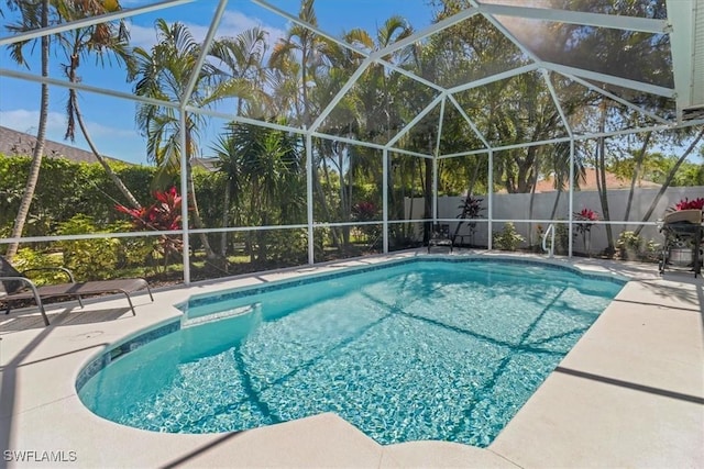 345 Sweet Bay Ln, Naples, FL 34119 - view of swimming pool with a patio area, a fenced backyard, a lanai, and a grill