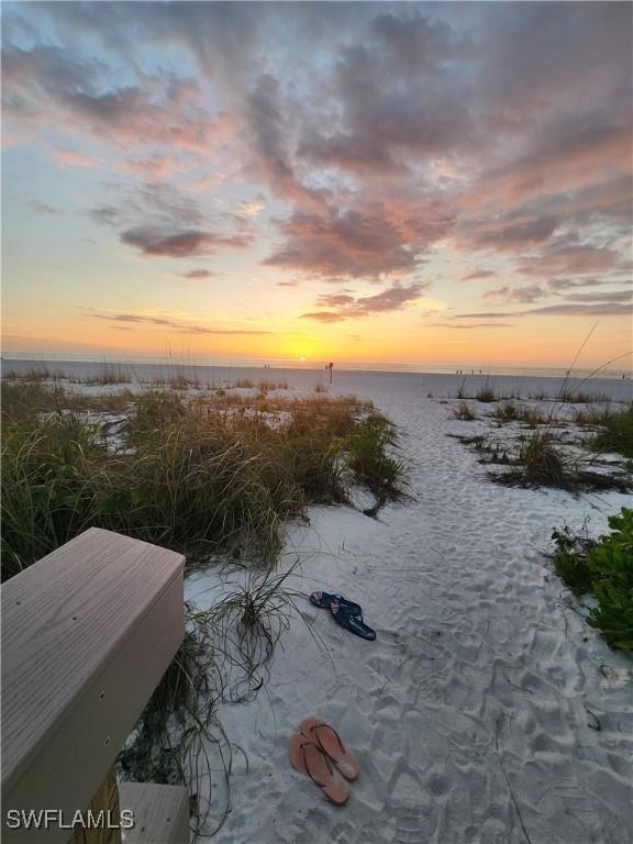 property view of water featuring a beach view