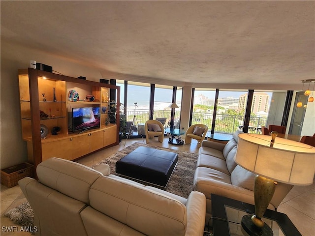 living area featuring expansive windows and light tile patterned flooring