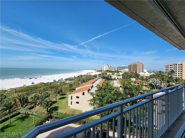 balcony with a beach view and a water view