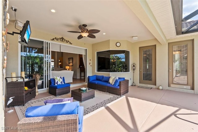 view of patio with an outdoor living space and a ceiling fan