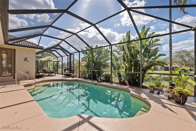 outdoor pool featuring a lanai and a patio