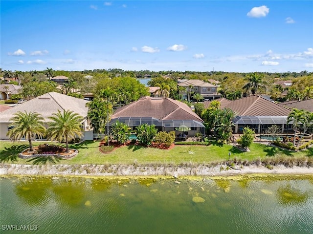 bird's eye view featuring a water view and a residential view