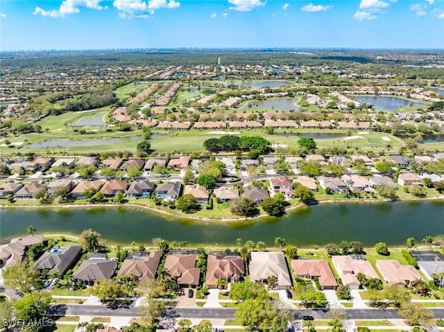 birds eye view of property featuring a water view and a residential view