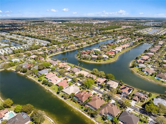 birds eye view of property with a residential view and a water view