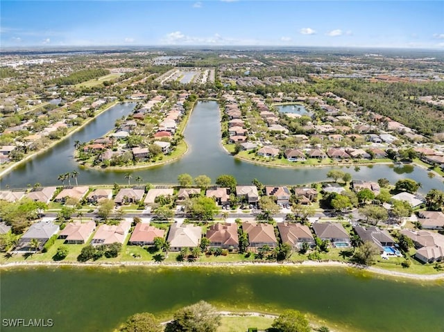 birds eye view of property with a water view and a residential view