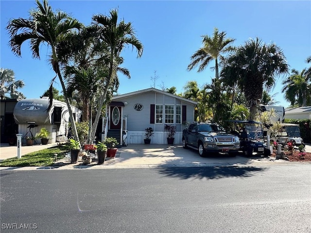 manufactured / mobile home with concrete driveway