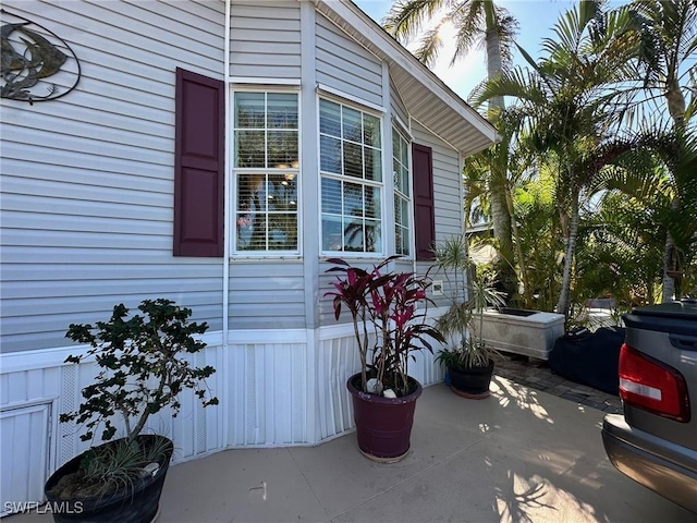 view of property exterior with a patio area