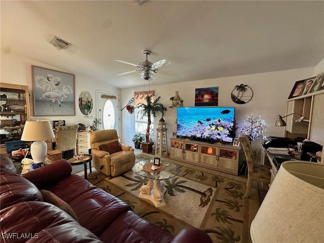 living room with visible vents and ceiling fan