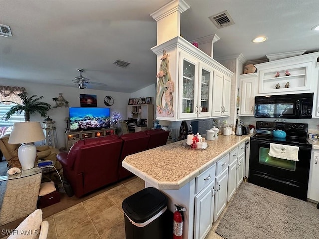 kitchen featuring visible vents, black appliances, open floor plan, white cabinets, and light countertops