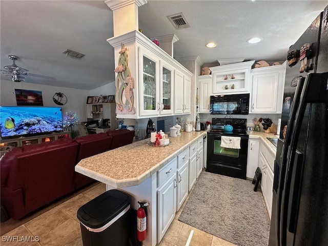 kitchen with visible vents, open floor plan, light countertops, white cabinets, and black appliances