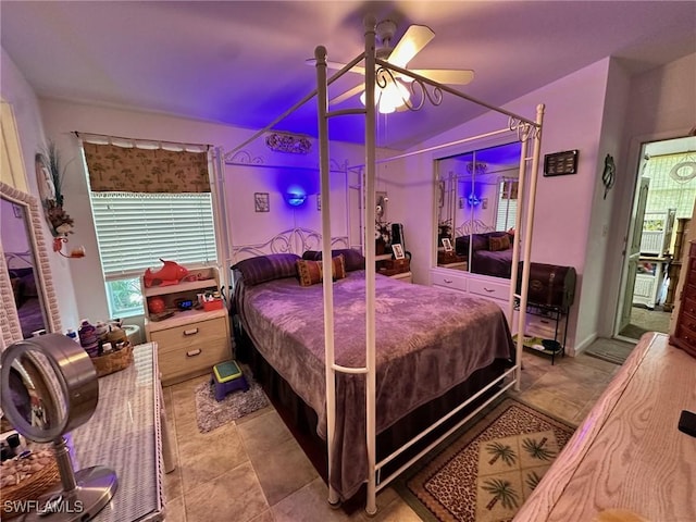 bedroom with vaulted ceiling and a ceiling fan