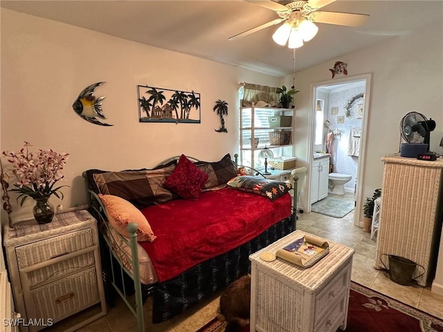 bedroom featuring ceiling fan and ensuite bath