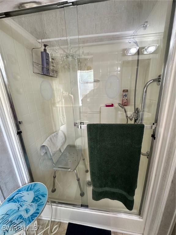 bathroom with a shower stall