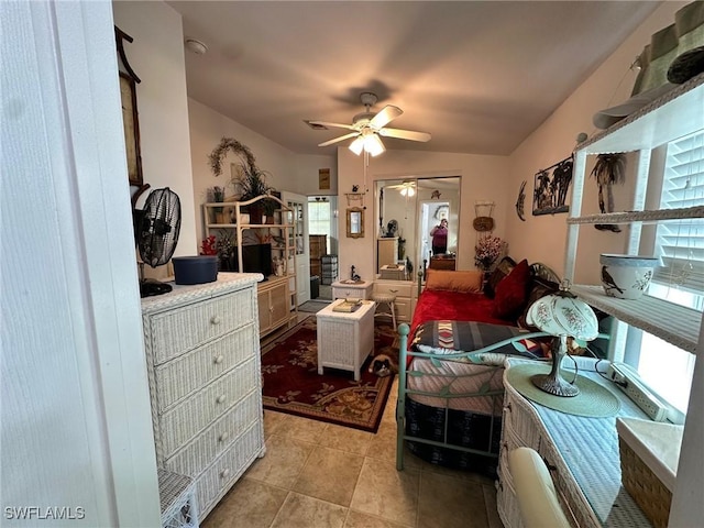 bedroom featuring light tile patterned flooring and a ceiling fan