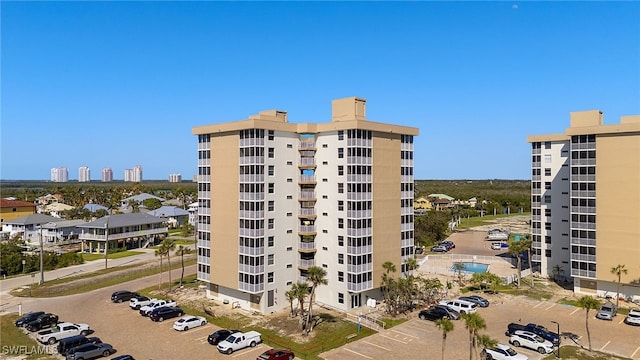 view of property featuring uncovered parking