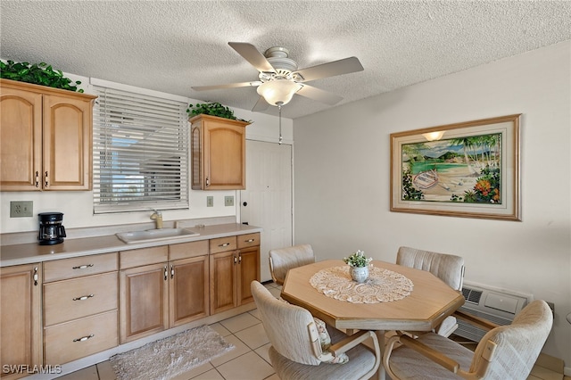 dining room with light tile patterned floors, a textured ceiling, and a ceiling fan