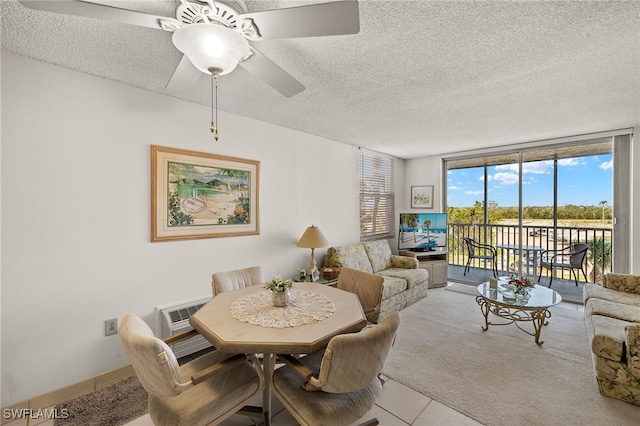 dining space featuring carpet flooring, a textured ceiling, a wall of windows, and ceiling fan