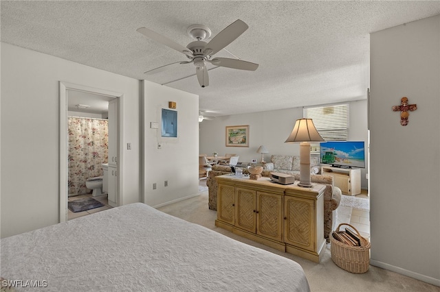 bedroom featuring carpet flooring, a textured ceiling, and a ceiling fan