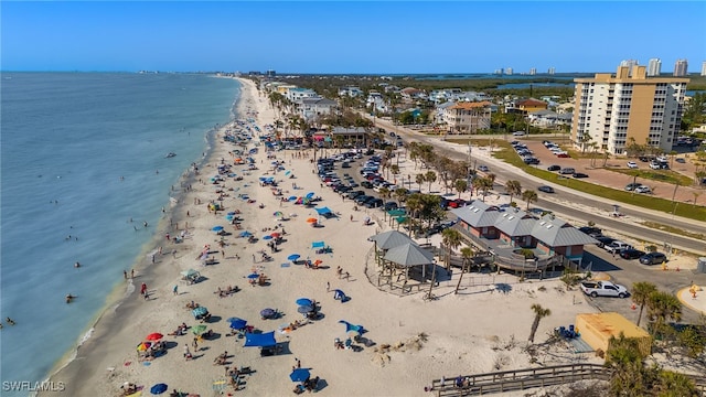 bird's eye view featuring a beach view and a water view