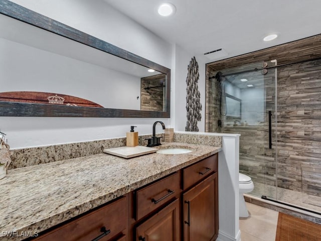 bathroom featuring toilet, a shower stall, recessed lighting, and vanity